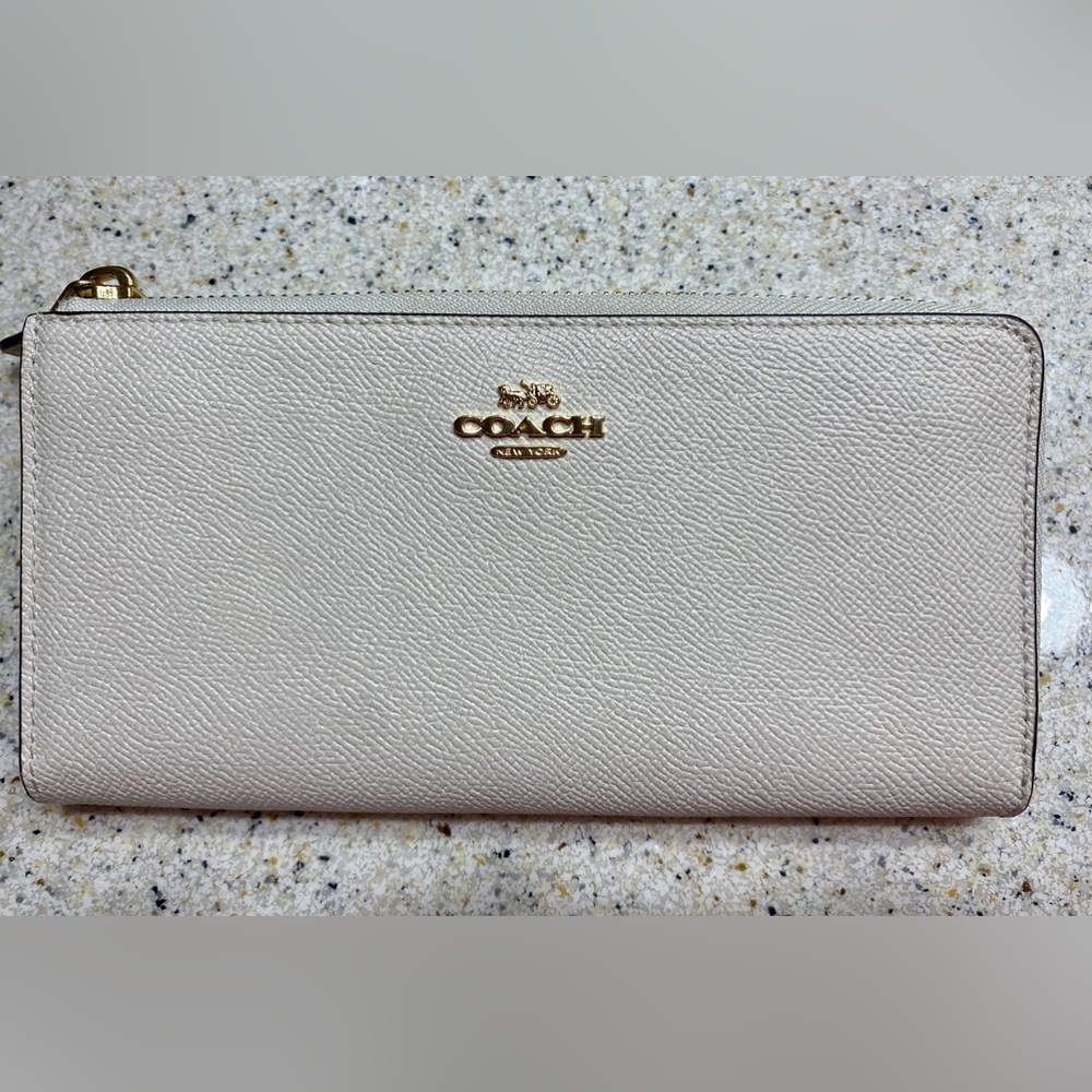Coach leather wallet. Accordion style. Cream color. Mint condition, no marks.